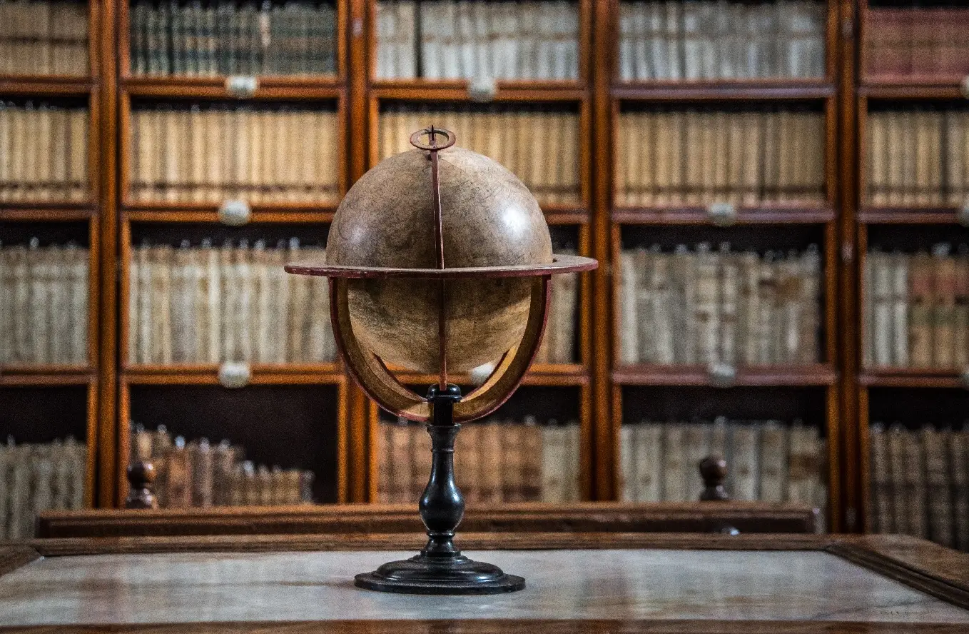 reading table with book shelves in background